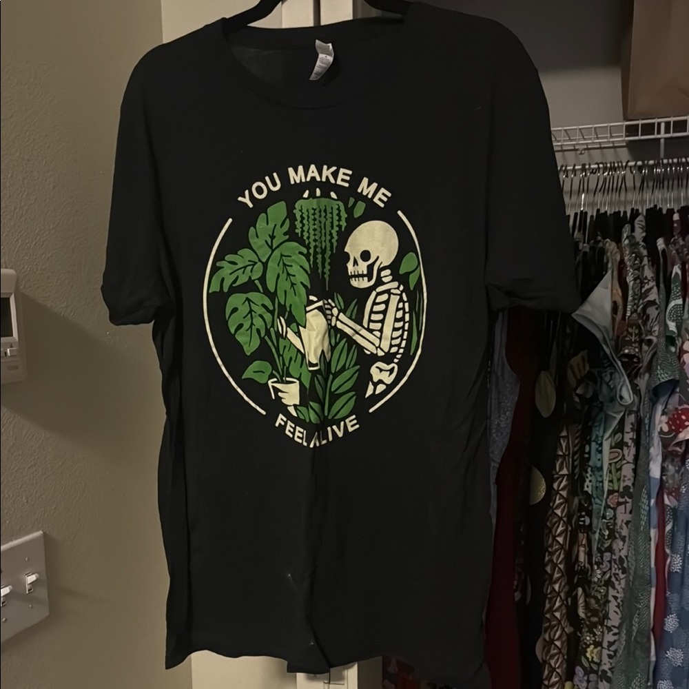 Black Graphic Tee with Skeleton and Plant Design